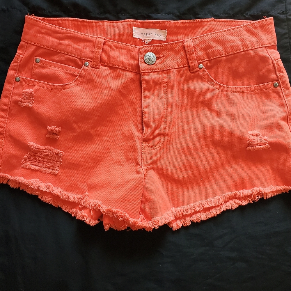 Red ripped jean shorts